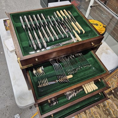Lot 980 - An oak four-drawer canteen of silver-plated...