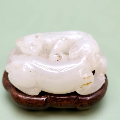 Lot 1347 - An antique oriental carved jade of two...