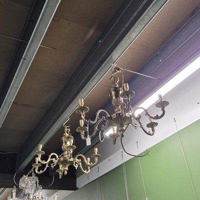 Lot 950 - A pair of brass chandeliers