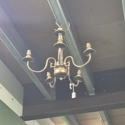 Lot 956 - A brass and glass chandelier