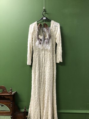 Lot 313 - A vintage sewn lace and bead gown with brown...