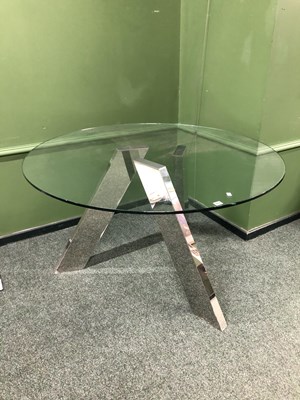 Lot 311 - A glass and chrome table
