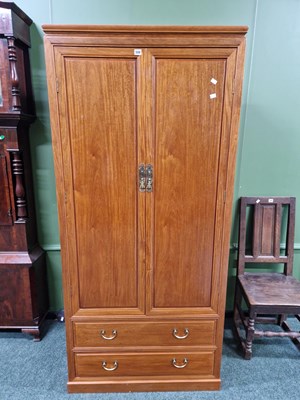 Lot 306 - A Chinese hardwood two door gentlemen's wardrobe