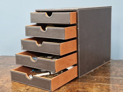 Lot 1355 - A leather mounted five drawer table top...