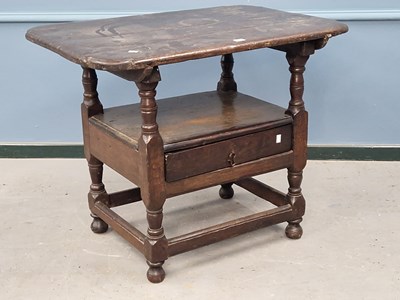 Lot 1366 - An 18th century oak monk's bench, the table...
