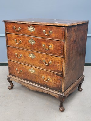 Lot 1371 - An 18th century walnut chest of four graded...