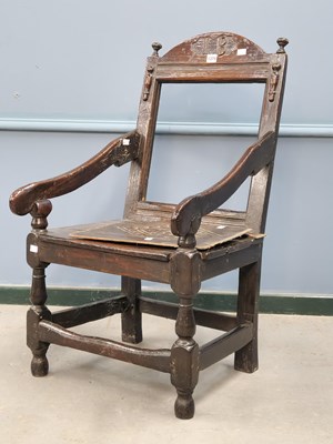 Lot 1374 - A 17th century oak armchair, the round arch...
