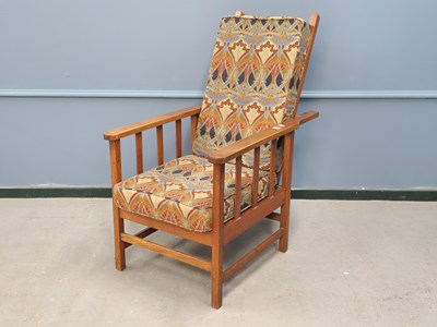 Lot 1380 - A Willam Morris style oak reclining armchair,...