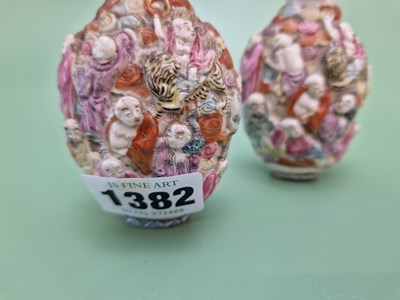 Lot 1382 - A pair of Chinese snuff bottles moulded in...