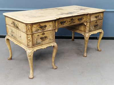 Lot 1387 - A cream ground chinoiserie decorated desk with...