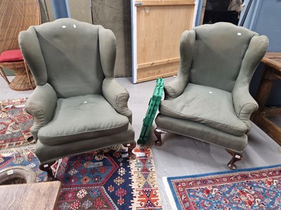Lot 1388 - A pair of mahogany wing back armchairs, the...