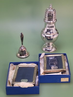 Lot 1399 - A silver baluster caster, Birmingham 1909, a...