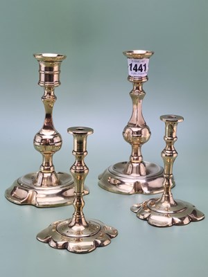 Lot 1441 - A pair of late 18th century brass petal based...