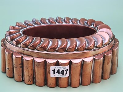 Lot 1447 - A copper oval crown topped ring mould. W 21cm