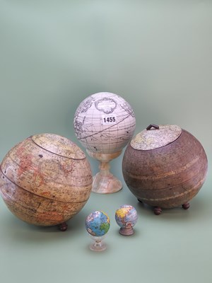 Lot 1455 - Two terrestrial globe biscuit tins, a...