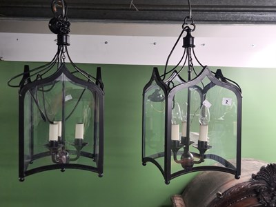 Lot 2 - A pair of wrought iron chandeliers