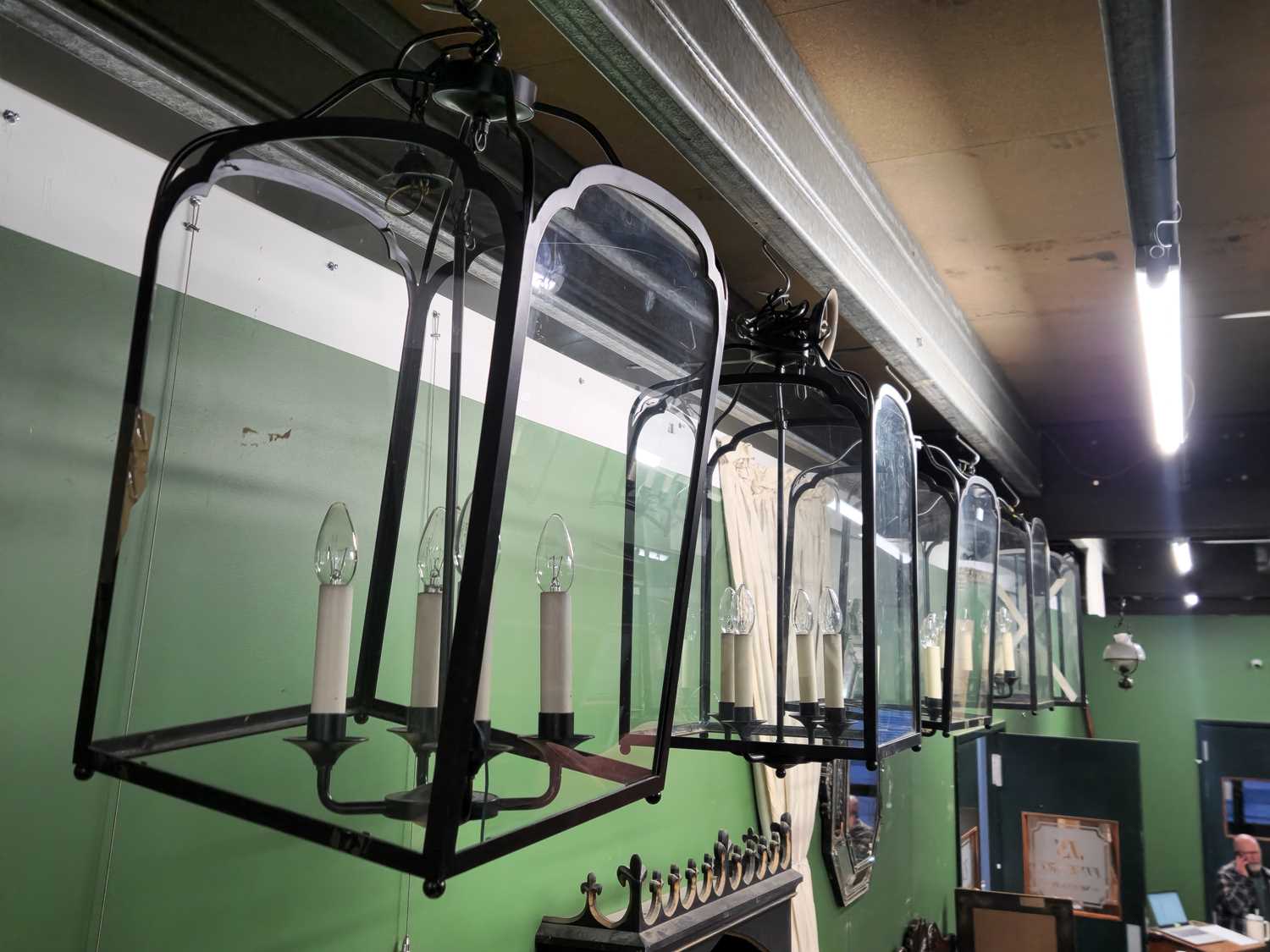 Lot 5 - Five wrought iron style painted metal chandeliers