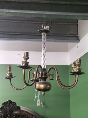 Lot 7 - A five arm brass chandelier