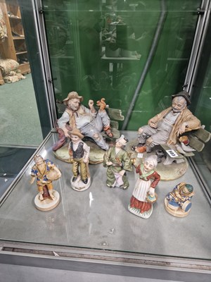 Lot 503 - Two Capodimonte tramp groups together with...