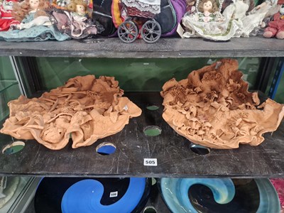 Lot 505 - A pair of terracotta leaves, one applied with...