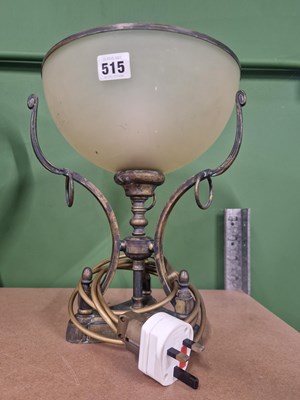 Lot 515 - A brass table lamp with a pale green glass...