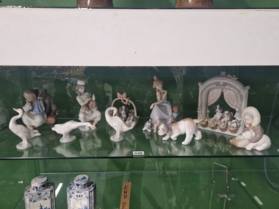 Lot 546 - A collection of nine Lladro porcelain figures