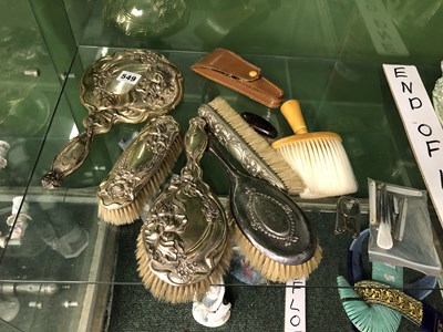 Lot 549 - A set of four silver backed dressing table...