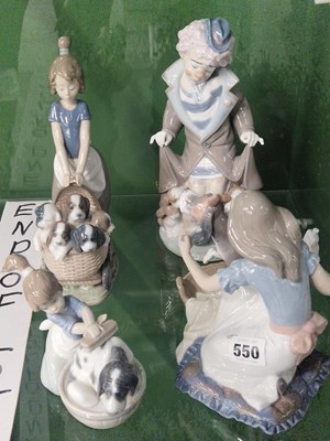 Lot 550 - Four Lladro porcelain dog and figure groups