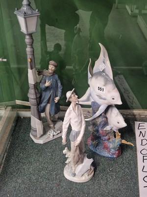 Lot 551 - Lladro: a fish group, a table lamp and a...