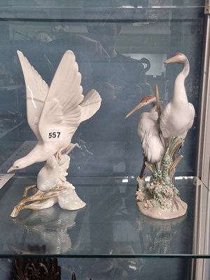 Lot 557 - A Lladro group of two cranes together with...