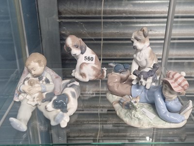 Lot 560 - Two Lladro seated dogs together with groups of...