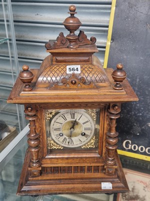 Lot 564 - An oak cased Junghans mantle clock striking on...