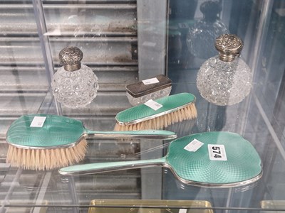 Lot 574 - A green enamel and silver three piece brush...