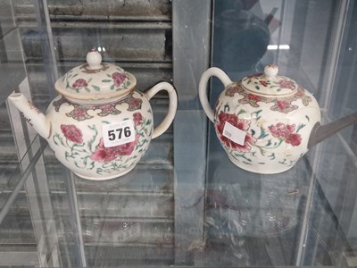 Lot 576 - Two Chinese famille rose floral tea pots and...