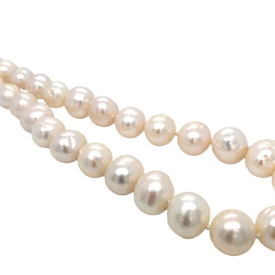 Lot 1017 - A white cultured pearl necklace with a silver...