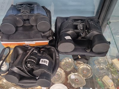 Lot 585 - Three cased pairs of binoculars
