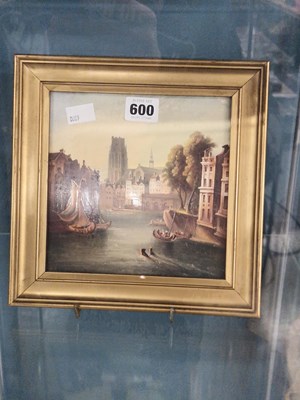 Lot 600 - A framed tile painted with boats in a town...