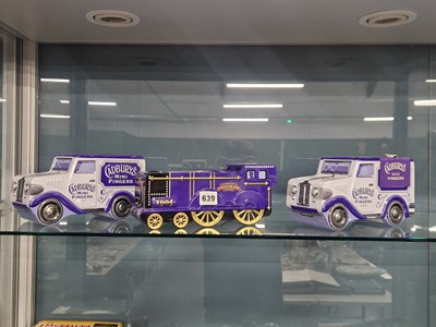 Lot 639 - Three Cadbury's Fingers tin boxes modelled as...