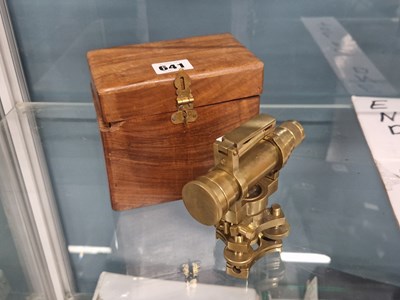 Lot 641 - A wooden boxed brass theodolite