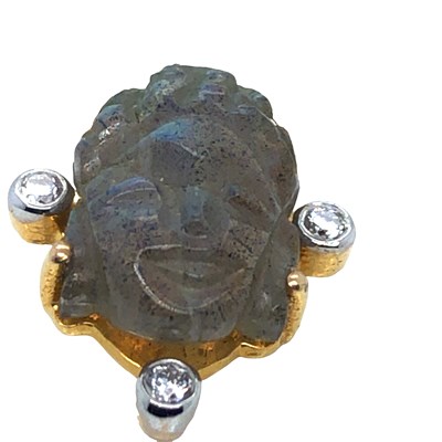 Lot 1022 - A carved Labradorite Buddha head and round cut...