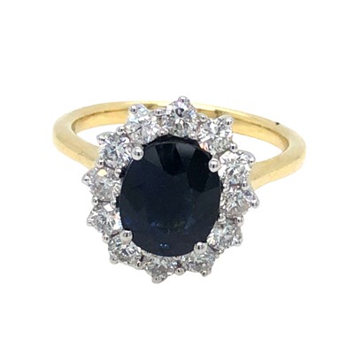 Lot 1024 - A hallmarked 18ct yellow and white gold oval...