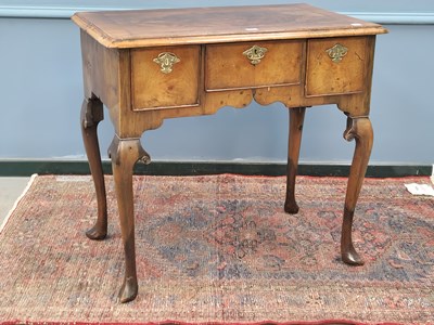 Lot 1521 - An 18th century walnut lowboy, the quarter...