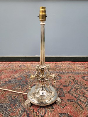 Lot 1527 - An electroplate table lamp raised on a reeded...