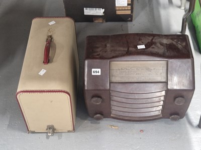 Lot 694 - A cased electric Universal sewing machine...