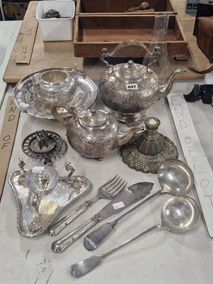 Lot 697 - An electroplate three piece tea set to include...
