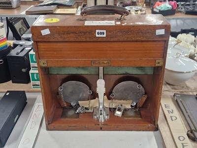 Lot 699 - A set of chemical balance scales in a mahogany...