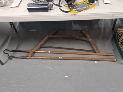 Lot 700 - A shepherd's crook, a bow saw and a bull's...