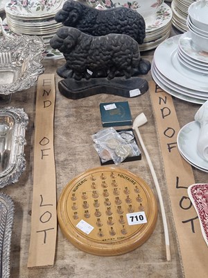 Lot 710 - Two iron sheep doorstops, a clay churchwarden...