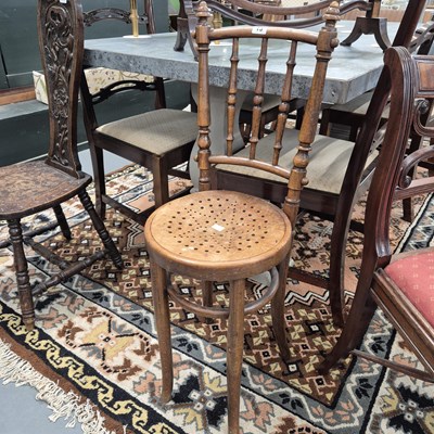 Lot 13 - An antique bentwood correction chair