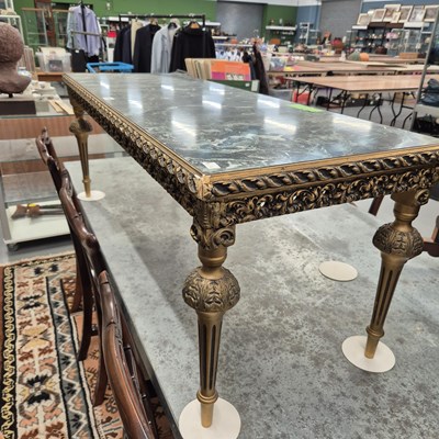 Lot 15 - A gilt decorated coffee table. H 47 W 123 D 48cm